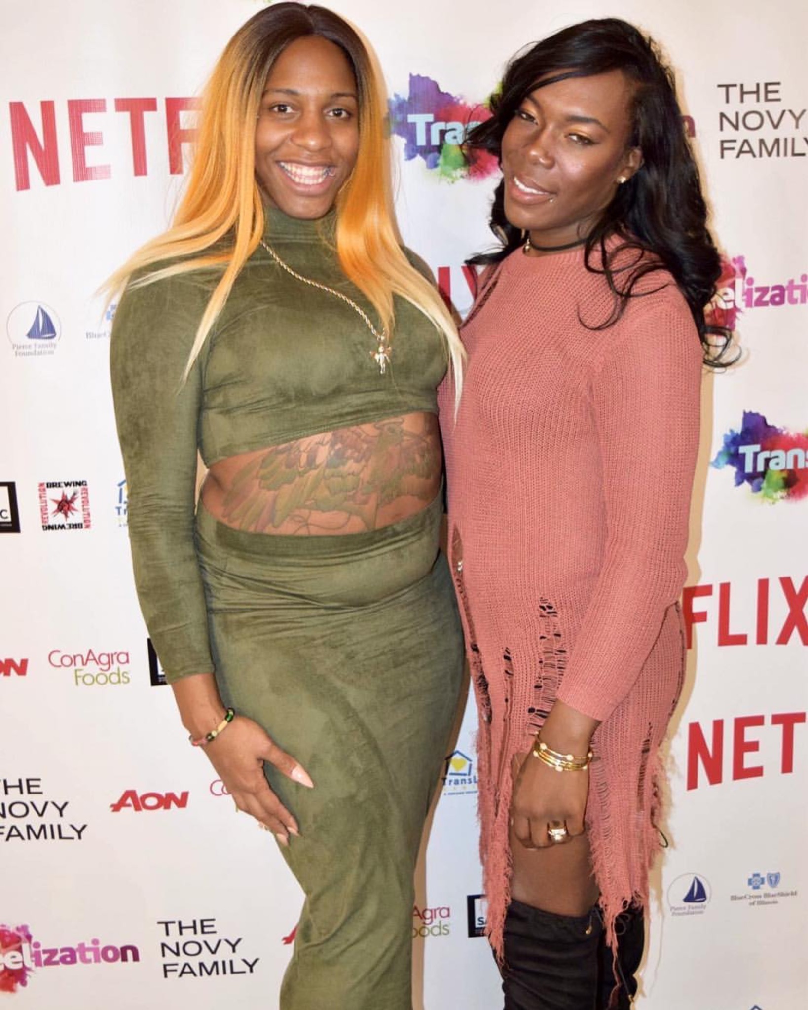 CeCe McDonald and Eisha Love posing together at a public event